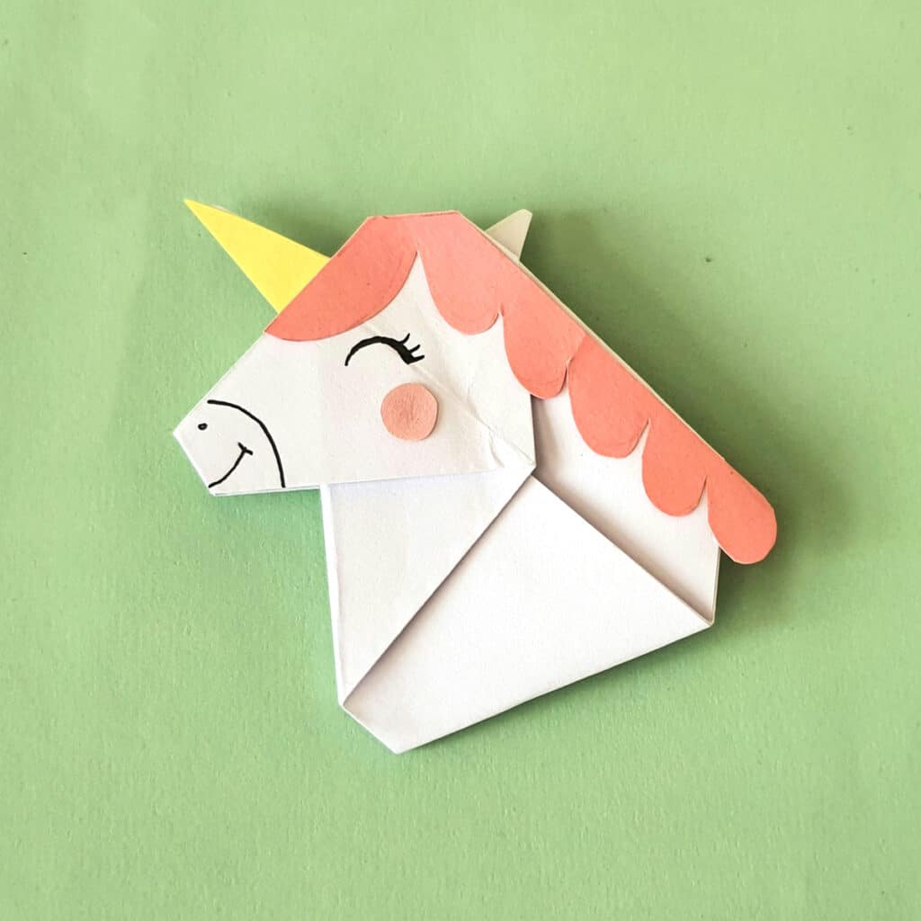 drawing the final design on the origami unicorn